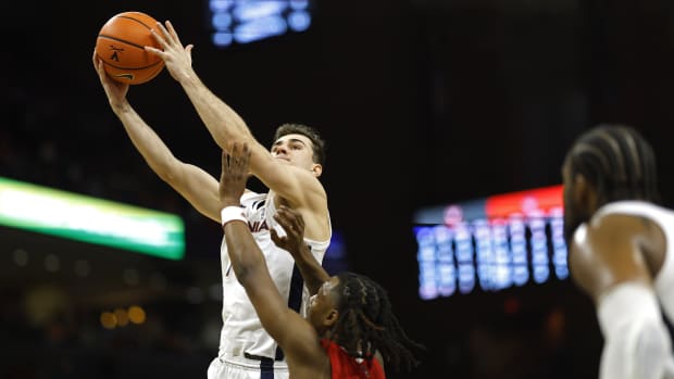 Virginia Cavaliers guard Taine Murray (10) shoots the ball as North Carolina State Wolfpack guard DJ Horne (0) defends in the second half at John Paul Jones Arena.